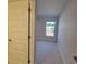 Bedroom featuring neutral tones and a window offering exterior views at 8344 Sw 57Th Ct, Ocala, FL 34476