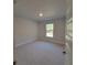 Bedroom featuring a neutral color scheme and a bright window at 8344 Sw 57Th Ct, Ocala, FL 34476