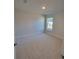A cozy bedroom featuring a neutral color scheme and a bright window at 8344 Sw 57Th Ct, Ocala, FL 34476