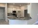 Stylish kitchen with white cabinets, granite countertops, and stainless steel appliances at 8344 Sw 57Th Ct, Ocala, FL 34476