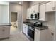 Modern kitchen featuring white cabinets, granite countertops and stainless-steel appliances at 8344 Sw 57Th Ct, Ocala, FL 34476