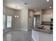 Open kitchen design with granite counters, stainless steel appliances, and tile flooring at 8344 Sw 57Th Ct, Ocala, FL 34476