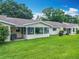Spacious backyard with a screen porch, providing an ideal space for outdoor relaxation at 8351 Sw 93Rd Ln # D, Ocala, FL 34481