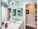 Inviting bathroom with vanity, large mirror and a decorative blue paint color at 8351 Sw 93Rd Ln # D, Ocala, FL 34481
