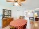 Dining room featuring wood floors, vintage furnishings, and access to kitchen at 8351 Sw 93Rd Ln # D, Ocala, FL 34481