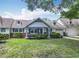 Charming single-story home with manicured lawn, mature trees, and an attached garage at 8351 Sw 93Rd Ln # D, Ocala, FL 34481