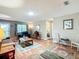 Comfortable living room featuring hardwood floors, natural light, and easy access to other rooms at 8351 Sw 93Rd Ln # D, Ocala, FL 34481