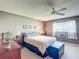 Comfortable bedroom with neutral tones, ceiling fan, and natural light at 8351 Sw 93Rd Ln # D, Ocala, FL 34481