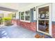 Inviting front porch with brick accents and a charming welcome mat at 8351 Sw 93Rd Ln # D, Ocala, FL 34481