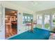 Bright sunroom offering views of the yard, featuring comfortable seating and a cheerful ambiance at 8351 Sw 93Rd Ln # D, Ocala, FL 34481