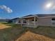 A spacious backyard with a covered patio, perfect for outdoor entertaining and relaxation at 8468 Sw 59Th Ter, Ocala, FL 34476
