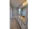 Bathroom with granite countertops and tiled floors at 8468 Sw 59Th Ter, Ocala, FL 34476