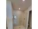 Bathroom featuring tiled walls, shower, and glass door at 8468 Sw 59Th Ter, Ocala, FL 34476