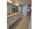 Bathroom vanity with granite countertops, double sinks, and tile flooring at 8468 Sw 59Th Ter, Ocala, FL 34476