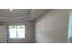 Bedroom featuring neutral walls, and a window with a view to the outside at 8468 Sw 59Th Ter, Ocala, FL 34476
