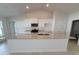 Modern kitchen featuring granite countertops, white cabinetry, and stainless steel appliances under recessed lighting at 8468 Sw 59Th Ter, Ocala, FL 34476