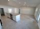 Spacious kitchen island with stainless steel dishwasher, granite countertops and tile floors in an open layout at 8468 Sw 59Th Ter, Ocala, FL 34476