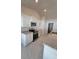 Kitchen with granite countertops, stainless steel appliances and white cabinets and tile floors at 8468 Sw 59Th Ter, Ocala, FL 34476