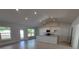 Bright, open-concept living space with recessed lighting, tile flooring, and a seamless transition to the kitchen at 8468 Sw 59Th Ter, Ocala, FL 34476