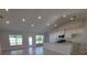 Bright, open-concept living space with recessed lighting, tile flooring, and a seamless transition to the kitchen at 8468 Sw 59Th Ter, Ocala, FL 34476