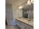 Bathroom with double sink vanity, large mirror, and sleek fixtures, designed for modern comfort and style at 8482 Sw 59Th Ter, Ocala, FL 34476