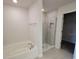 Bathroom features a soaking tub and glass-enclosed shower, offering both style and functionality at 8482 Sw 59Th Ter, Ocala, FL 34476