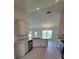 Open concept kitchen with stainless appliances and access to backyard at 8482 Sw 59Th Ter, Ocala, FL 34476