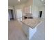 Large island with stainless sink in a bright open kitchen at 8482 Sw 59Th Ter, Ocala, FL 34476
