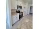 Kitchen area featuring stainless steel oven and microwave at 8482 Sw 59Th Ter, Ocala, FL 34476