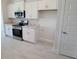 Kitchen area featuring stainless steel oven and microwave at 8482 Sw 59Th Ter, Ocala, FL 34476
