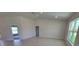 Bright living room features tile floors, recessed lighting, and large windows that let in ample natural light at 8482 Sw 59Th Ter, Ocala, FL 34476