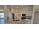 Open kitchen with a granite-topped island, stainless appliances, and white cabinetry at 8483 Sw 59Th Ter, Ocala, FL 34476
