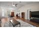Bright living room boasts vaulted ceilings, wood floors, ceiling fan, and an open layout at 8990 Se 155Th Pl, Summerfield, FL 34491