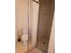 Bathroom featuring a glass enclosed walk-in shower and toilet at 9012 Sw 91St Cir, Ocala, FL 34481