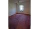 Bedroom with a ceiling fan, and a window with view to the outside with wall to wall carpeting at 9012 Sw 91St Cir, Ocala, FL 34481