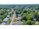 This aerial view shows the home's setting in a community with mature trees and well-kept streets at 9058 Sw 108Th Pl, Ocala, FL 34481