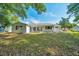 Well-maintained backyard showcasing the home's exterior and outdoor space at 9058 Sw 108Th Pl, Ocala, FL 34481