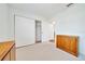 Bedroom space with closet and window with natural light, neutral carpet, and light walls at 9058 Sw 108Th Pl, Ocala, FL 34481