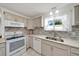 Well-lit kitchen features updated countertops, backsplash and stainless steel appliances at 9058 Sw 108Th Pl, Ocala, FL 34481