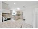 Bright kitchen with tile floors, stainless steel appliances, and elegant countertops at 9058 Sw 108Th Pl, Ocala, FL 34481