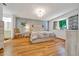 Cozy main bedroom with wood floors, soft blue accent wall and relaxing decor at 9058 Sw 108Th Pl, Ocala, FL 34481