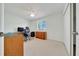 Bright office space with a large window, desk, and ample storage at 9058 Sw 108Th Pl, Ocala, FL 34481