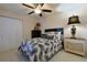 Comfortable bedroom with stylish decor, ceiling fan, and ample closet space at 9088 Sw 95Th Ave, Ocala, FL 34481