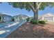 Charming single-story home with a well-maintained lawn, mature trees, and a two-car garage at 9088 Sw 95Th Ave, Ocala, FL 34481