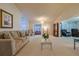 Bright living room featuring neutral tones, an open layout, and comfortable seating arrangements at 9088 Sw 95Th Ave, Ocala, FL 34481