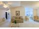 Open-concept living room connects to the kitchen and features neutral decor at 9088 Sw 95Th Ave, Ocala, FL 34481