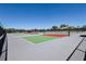 Well-maintained tennis courts with nets ready for a friendly match on a sunny day at 9088 Sw 95Th Ave, Ocala, FL 34481