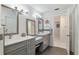 Bathroom featuring a double vanity with sleek countertops and stylish fixtures at 9900 Ne 20 Terrace Rd, Anthony, FL 32617