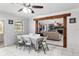 Inviting dining area featuring an open layout and seamless flow into the adjacent living room at 9900 Ne 20 Terrace Rd, Anthony, FL 32617