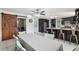 Modern kitchen featuring sleek, black cabinets, a marble countertop, and a stylish barn door accent at 9900 Ne 20 Terrace Rd, Anthony, FL 32617